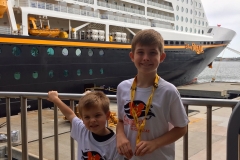 Posing at the DIsney Cruise Line Port in front of the DIsney Dream