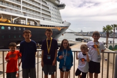 Posing at the DIsney Cruise Line Port in front of the DIsney Dream