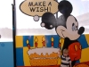 Hunter in front of Mickey Mouse sign